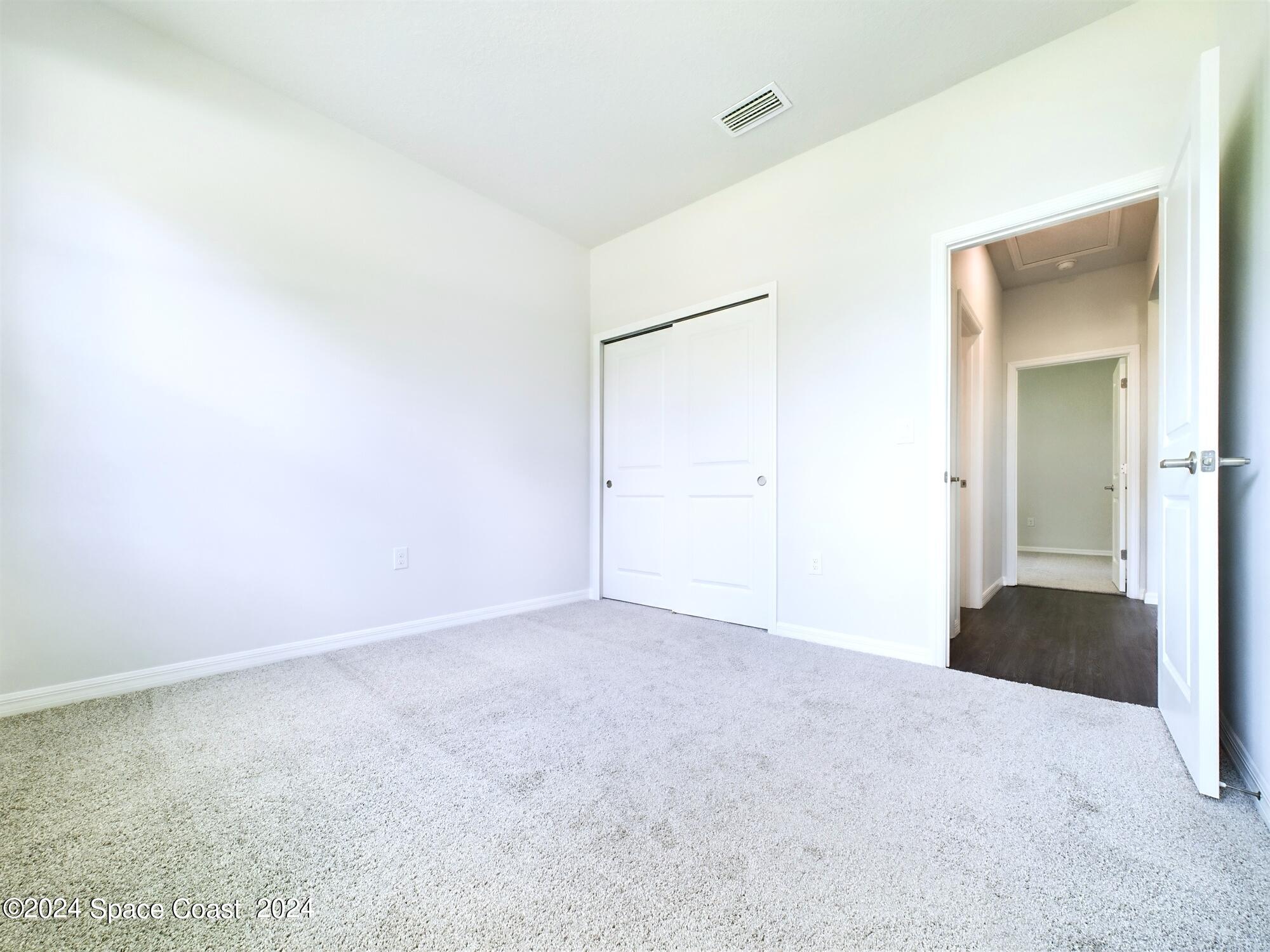 842 Angelico Road Northwest Palm Bay, FL 32907 - Photo 11 of 22 an empty room with an entryway