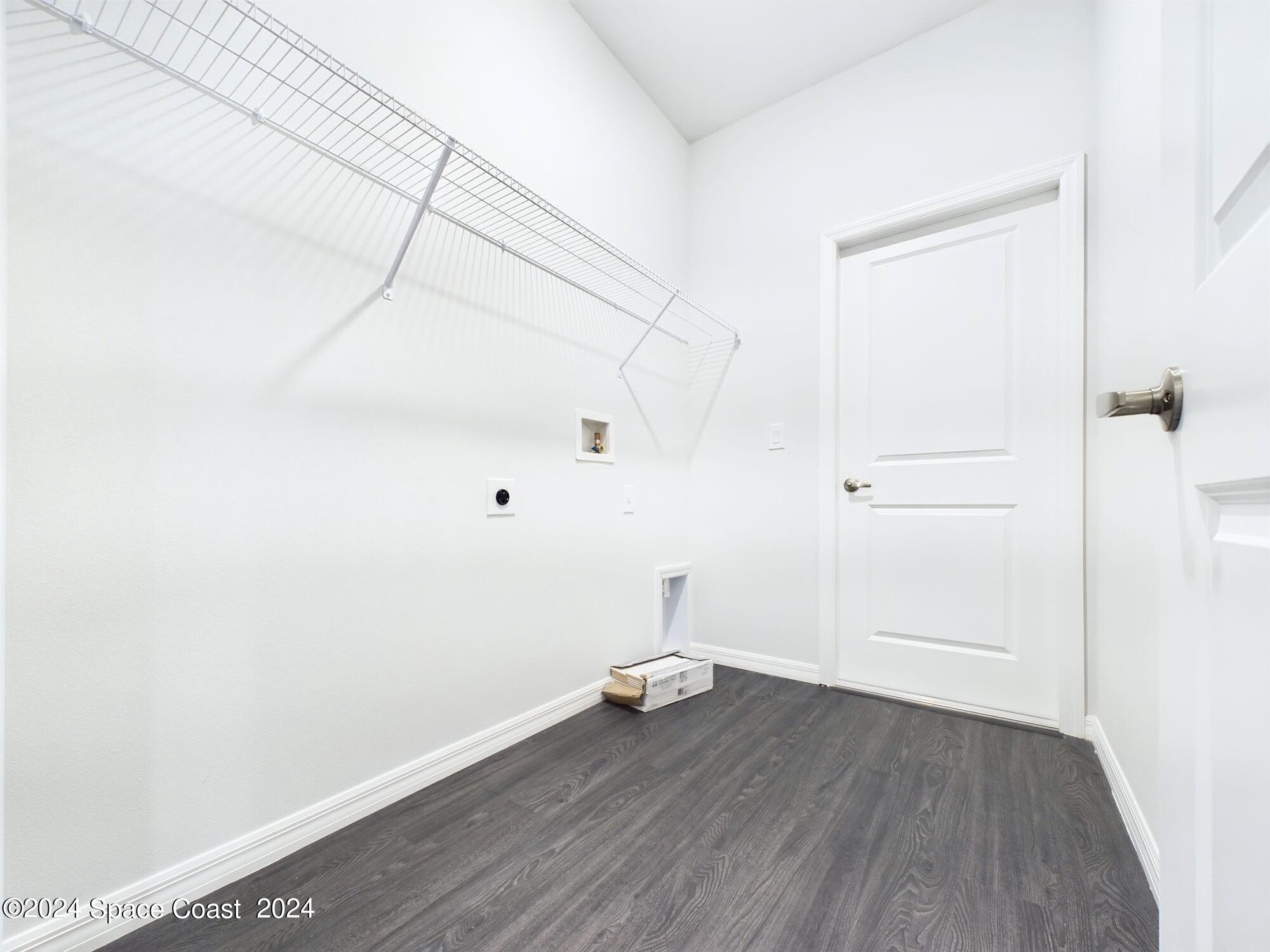 842 Angelico Road Northwest Palm Bay, FL 32907 - Photo 14 of 22 a view of a room with wooden floor