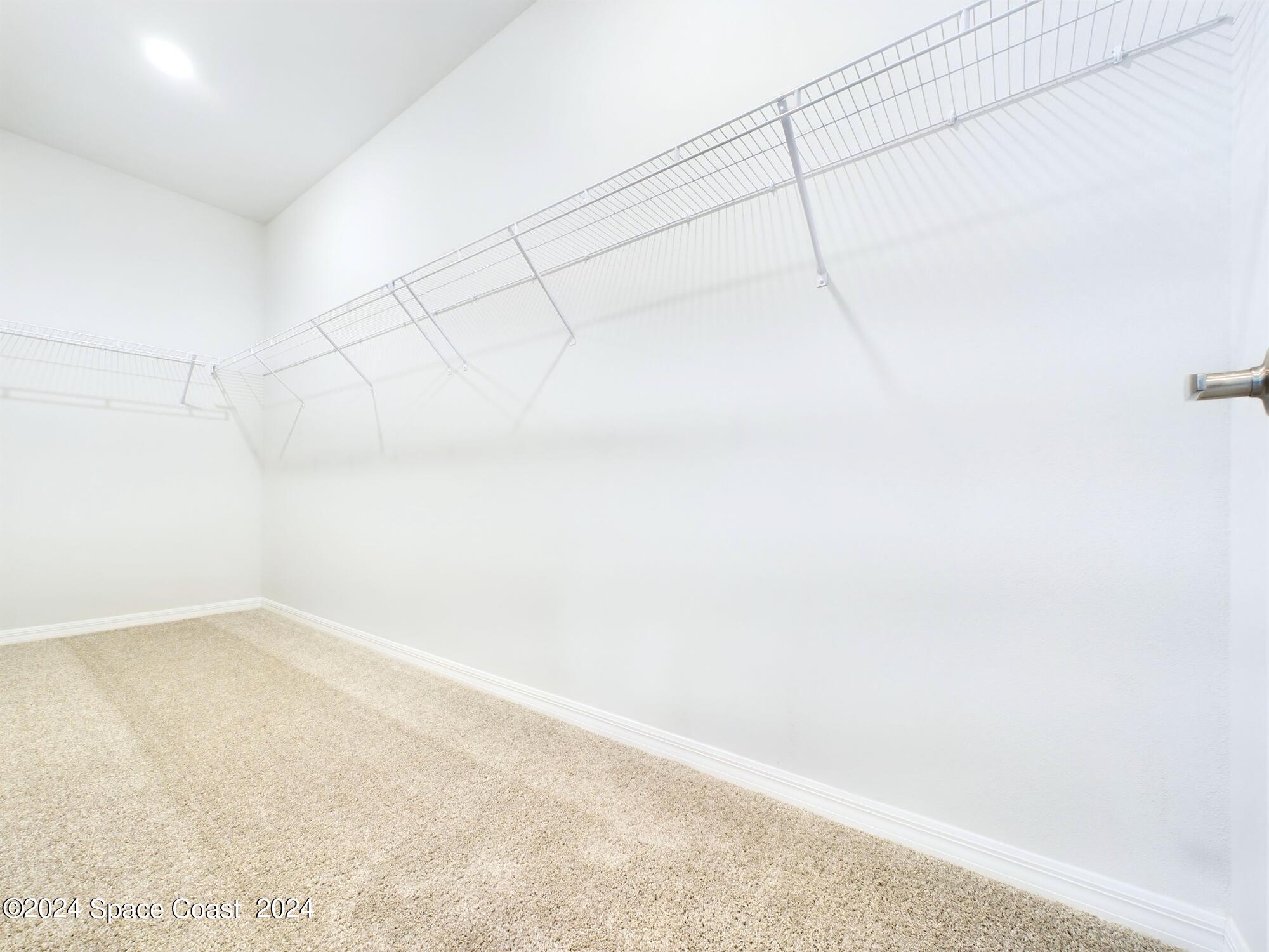 842 Angelico Road Northwest Palm Bay, FL 32907 - Photo 15 of 22 a view of a room with racks on the wall