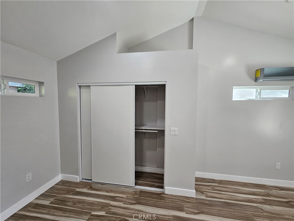 6570 Mt Diablo Avenue Riverside, CA 92506 - Photo 8 of 15 a view of a livingroom with wooden floor and cabinet