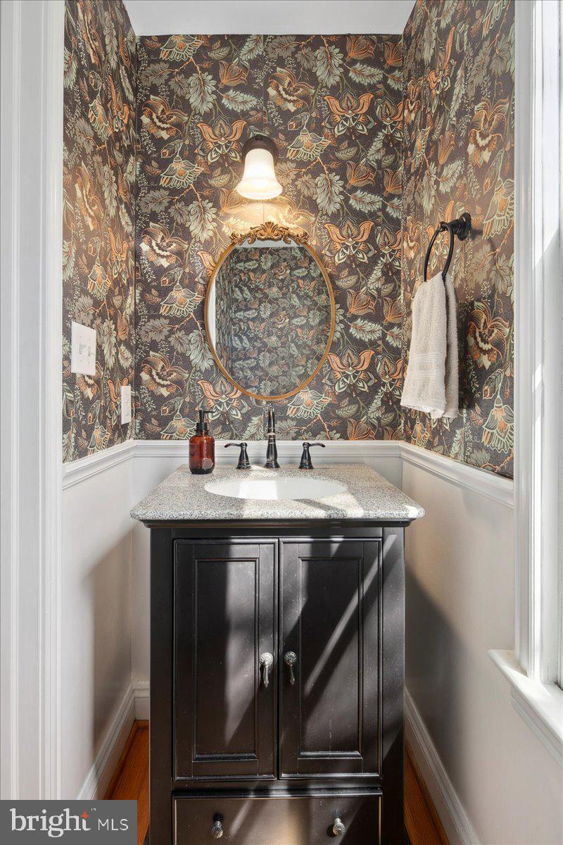 802 Pendleton Street Alexandria, VA 22314 - Photo 19 of 36 a bathroom with a sink and mirror