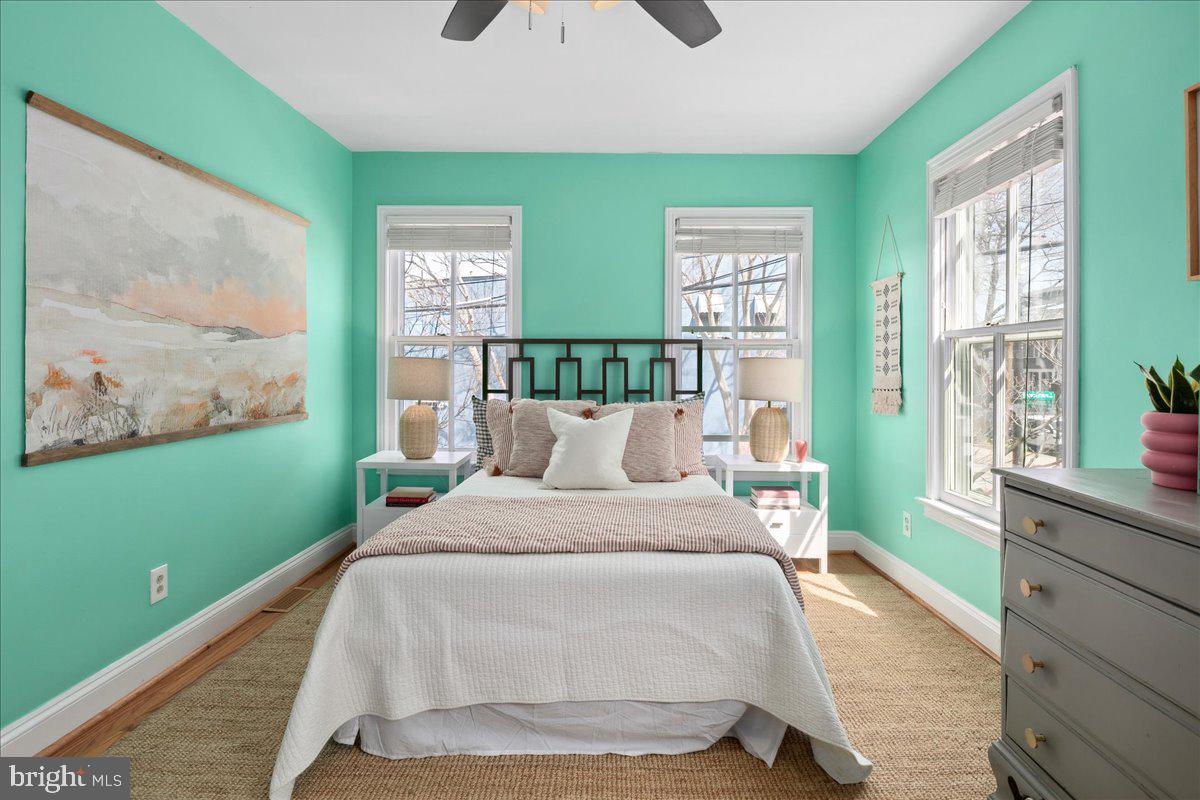 802 Pendleton Street Alexandria, VA 22314 - Photo 21 of 36 a bedroom with a bed and windows