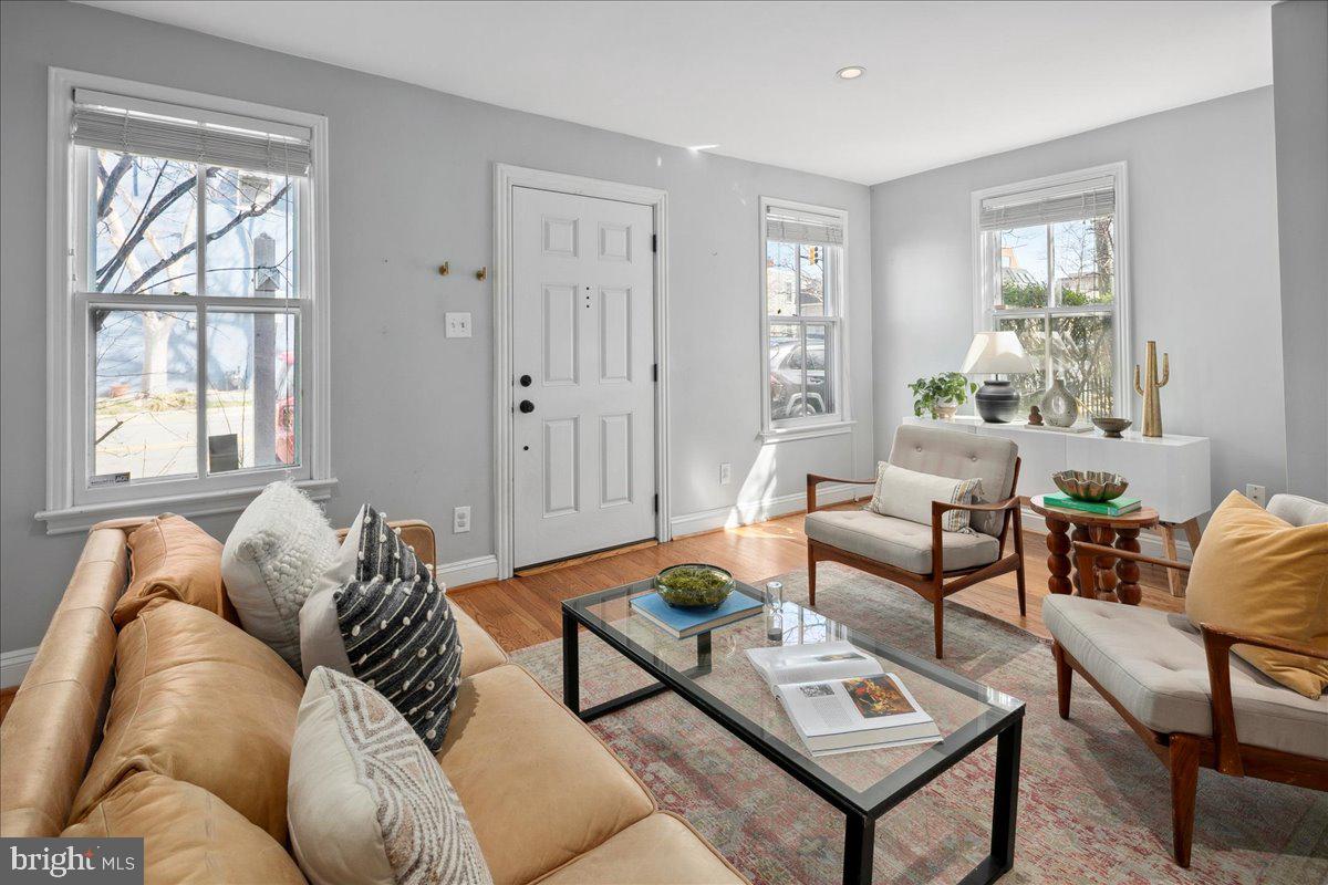802 Pendleton Street Alexandria, VA 22314 - Photo 9 of 36 a living room with furniture and a large window