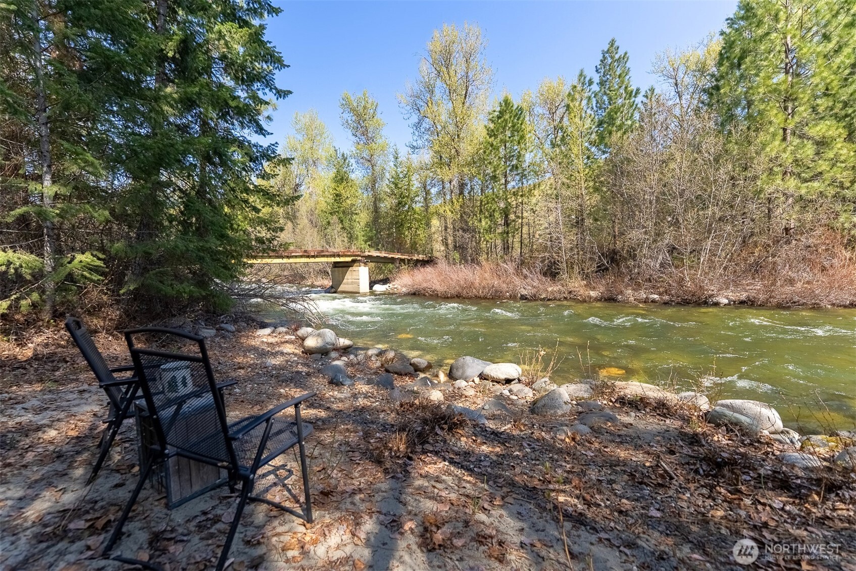 583 B Twisp River Road Twisp, WA 98856 - Photo 2 of 39 a view of a lake from a yard