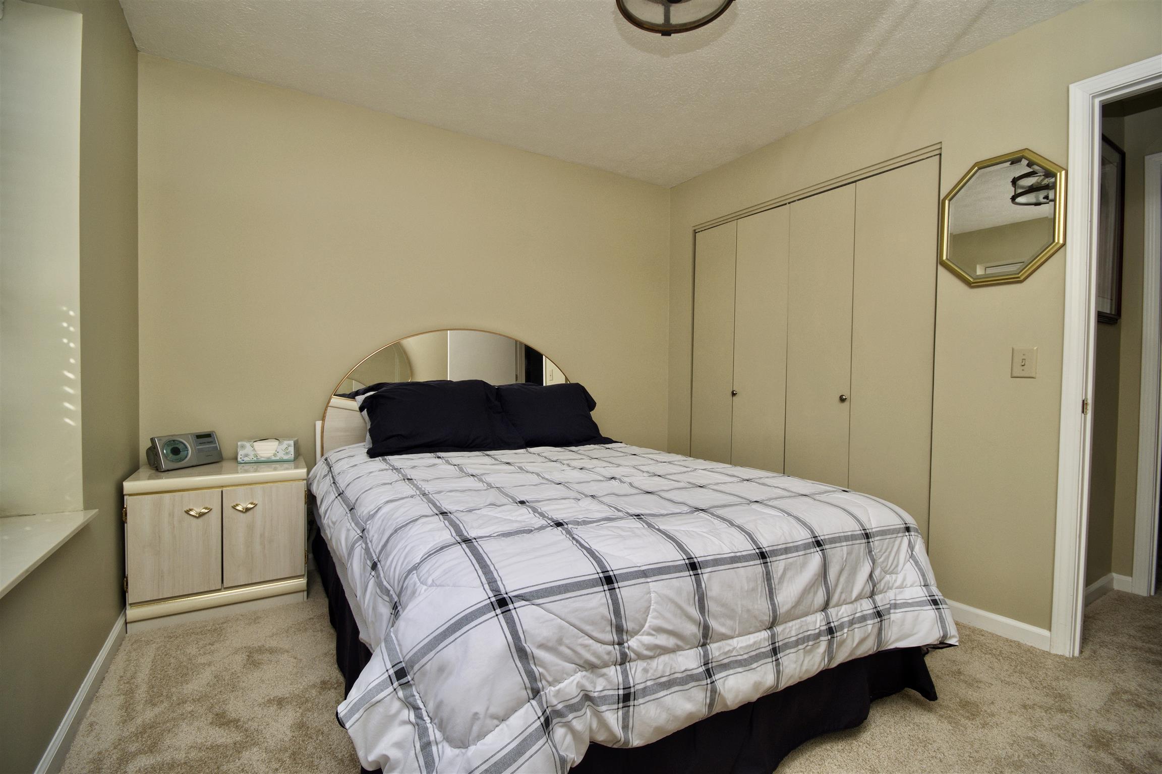1001 Jacksons Valley Road Hermitage, TN 37076 - Photo 10 of 15 a bedroom with a bed and a closet