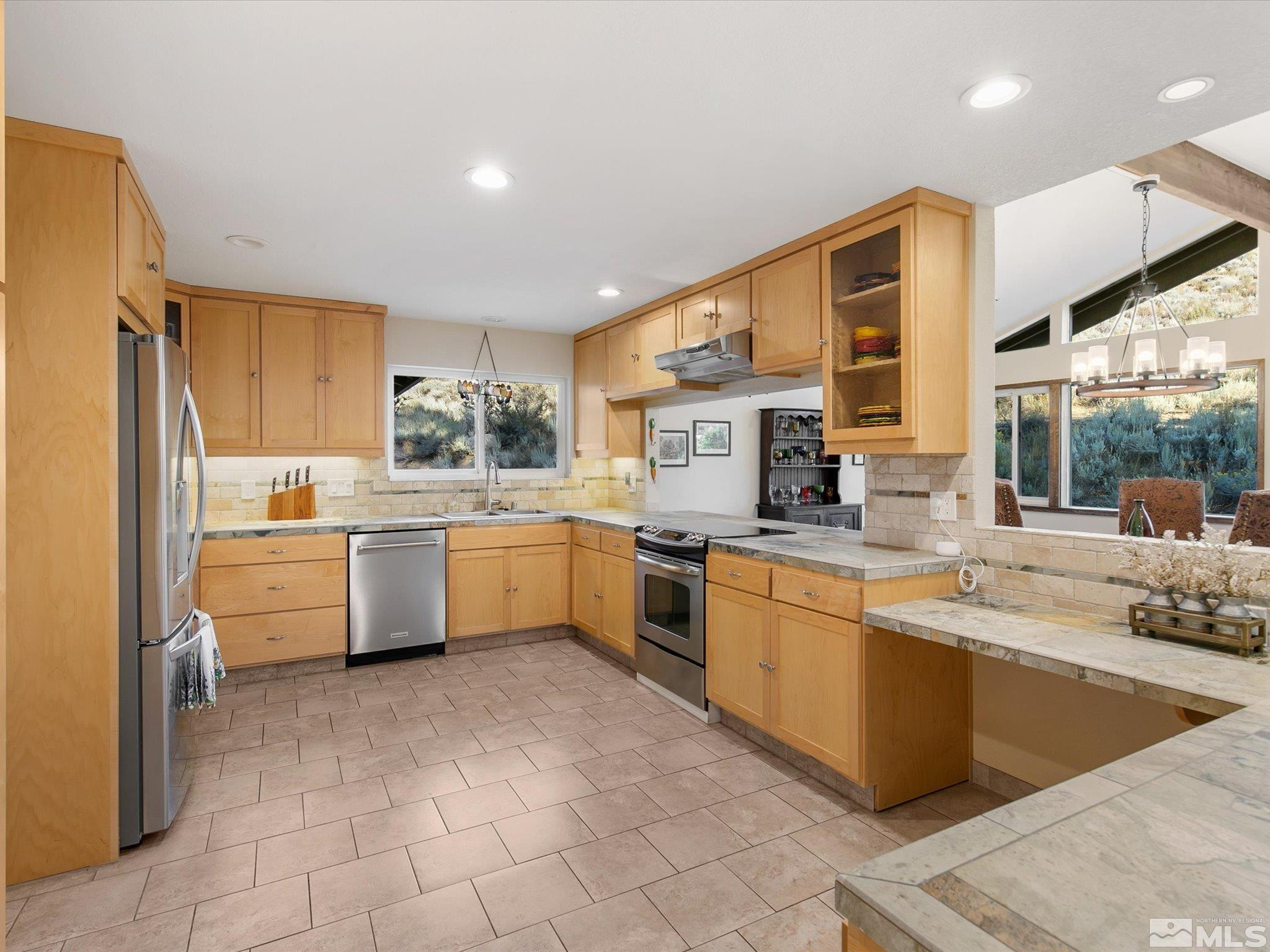 3750 Buckskin Road Carson City, NV 89703 - Photo 11 of 38 a kitchen with a sink window and cabinets