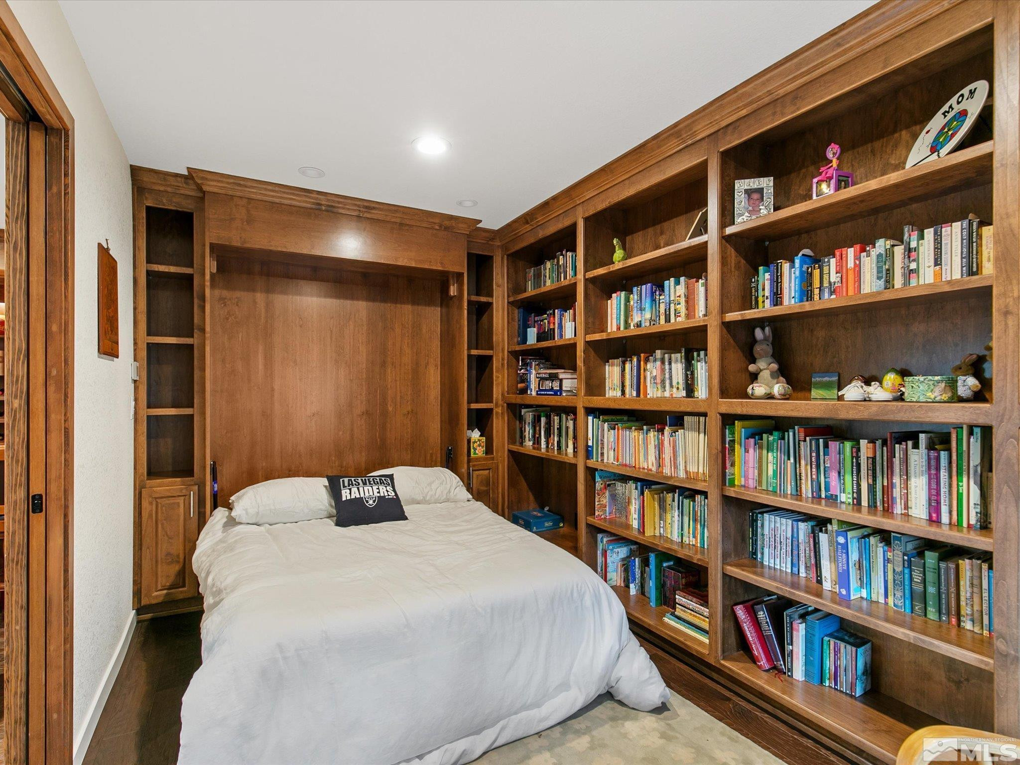 3750 Buckskin Road Carson City, NV 89703 - Photo 25 of 38 a bedroom with a bed and a book shelf