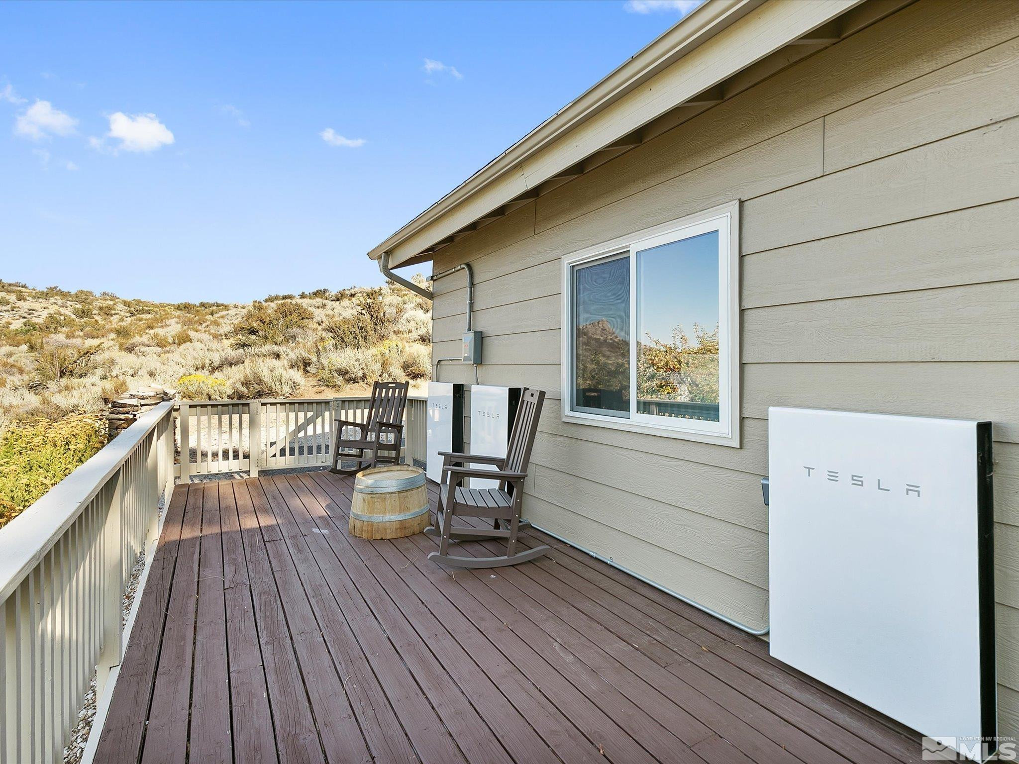 3750 Buckskin Road Carson City, NV 89703 - Photo 4 of 38 a view of a balcony with chair and wooden floor