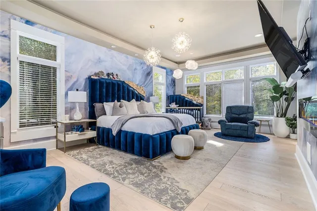 a bedroom with furniture and window