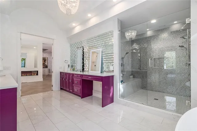 a bedroom with a large bed and a large window