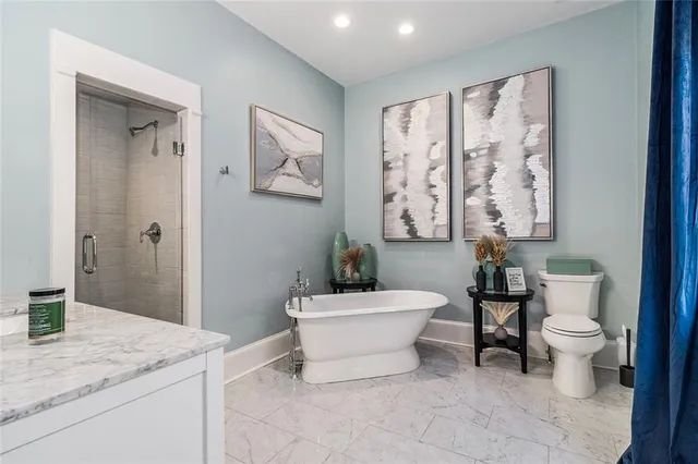 a bathroom with a bathtub and a sink