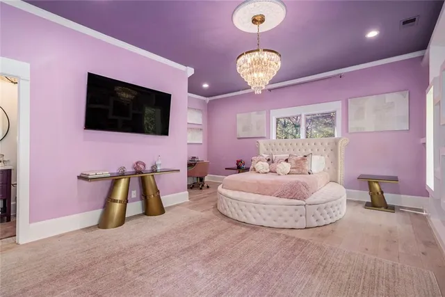 a bed room with a bed mirror and a window