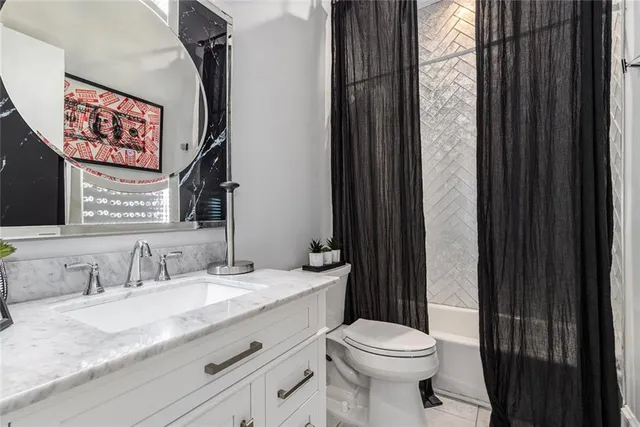 a utility room with sink dryer and washer