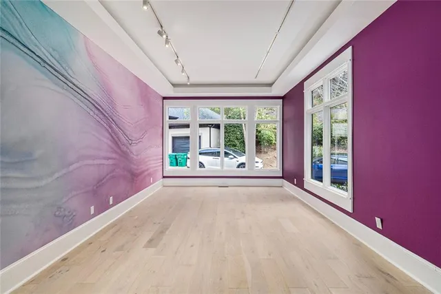 a media room with lots of chairs and a projector screen