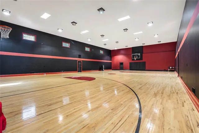 a room with lots of baby toys and flat screen tv