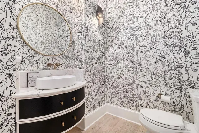 an aerial view of a house with a yard and large trees