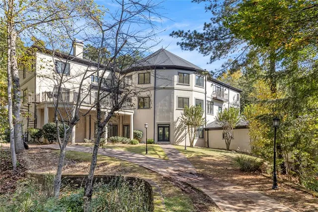 an aerial view of a house with yard and outdoor seating