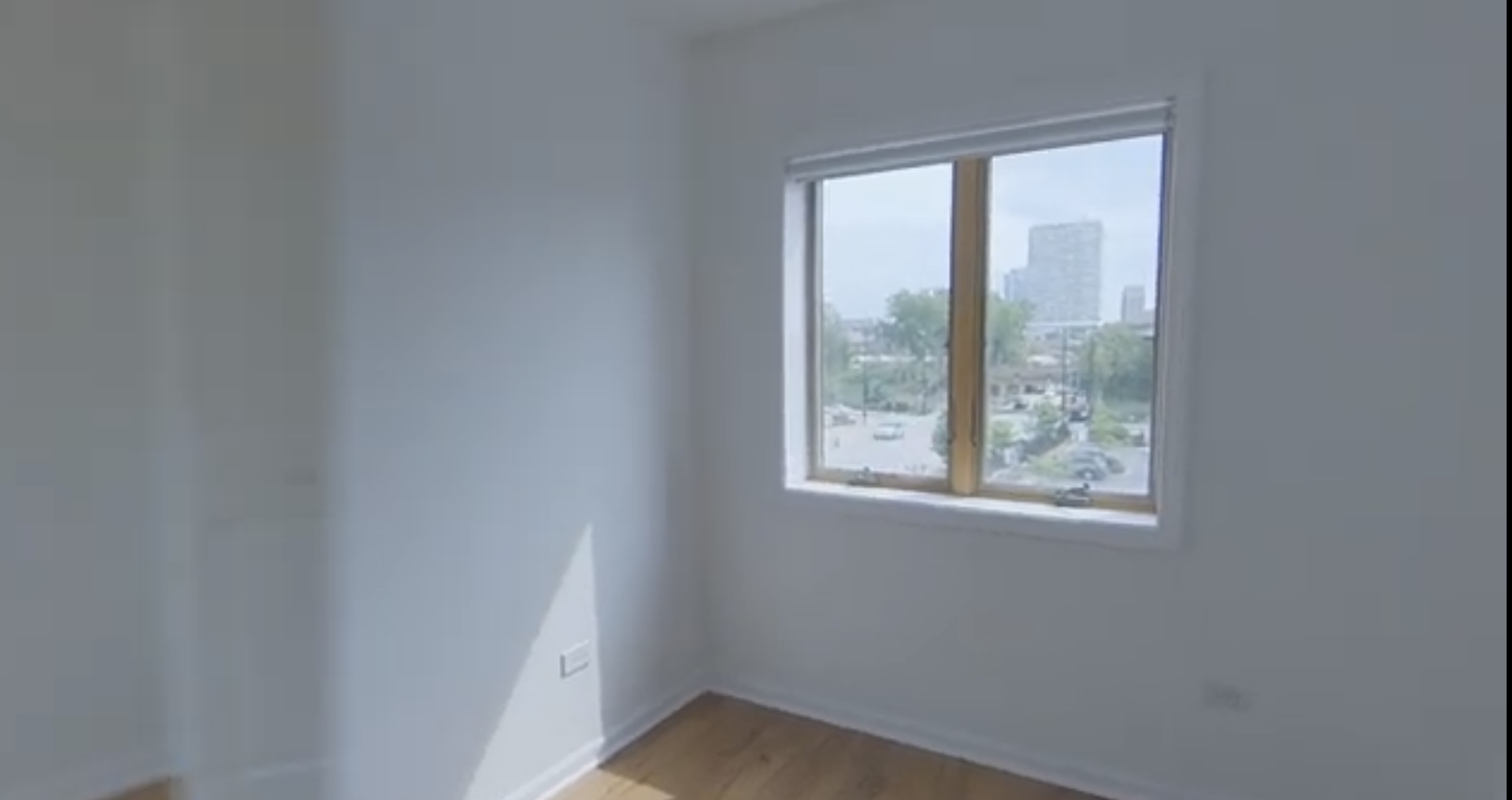 231 West 18th Street, Unit 2A Chicago, IL 60616 - Photo 7 of 9 an empty room with a window