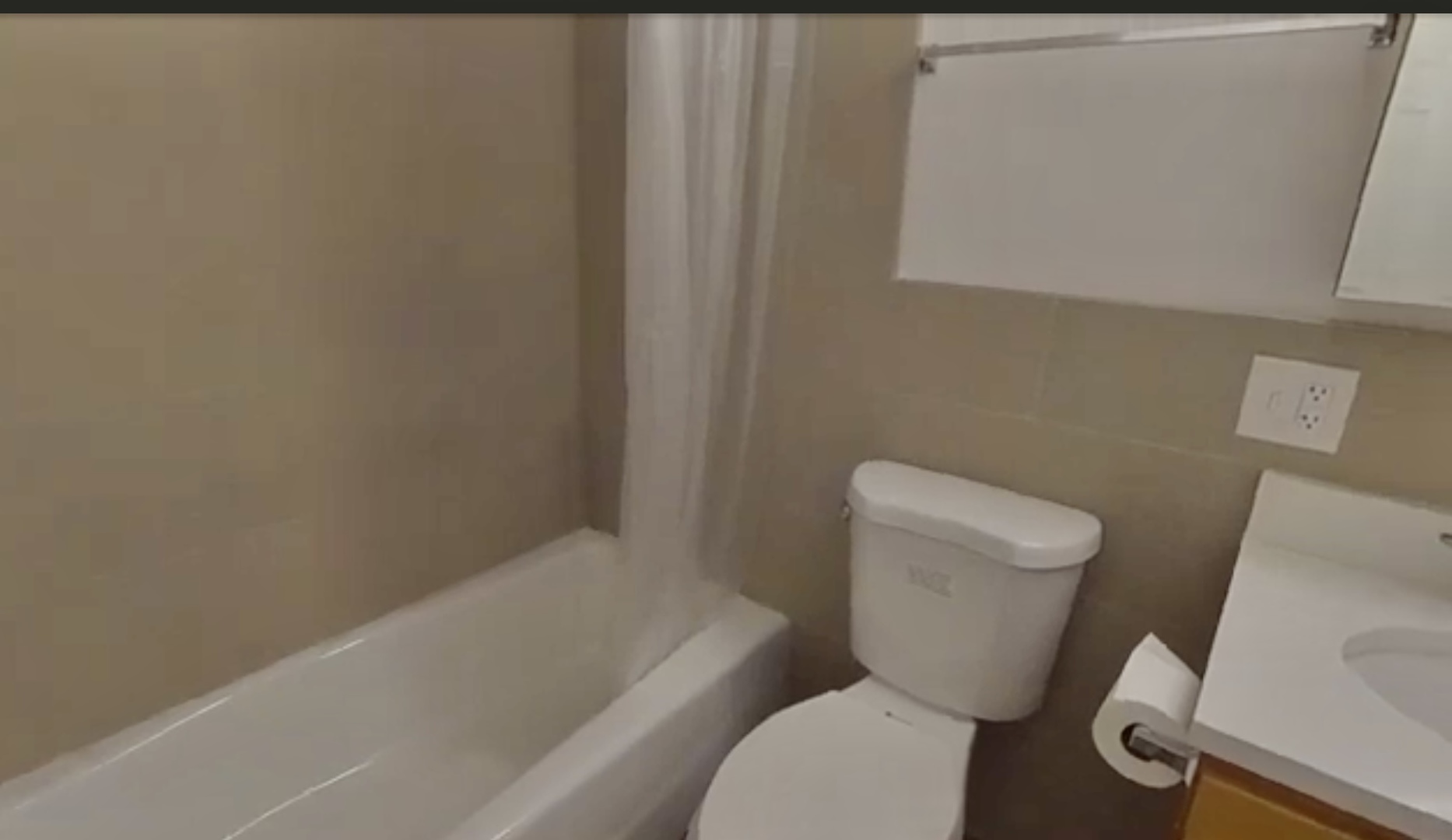 231 West 18th Street, Unit 2A Chicago, IL 60616 - Photo 8 of 9 a white toilet sitting next to a bath tub