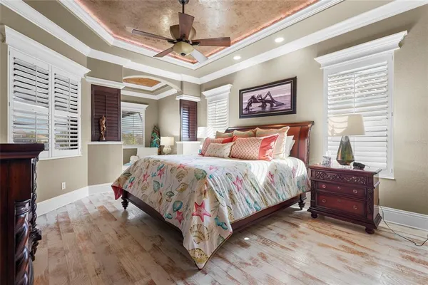 a living room with furniture and a book shelf