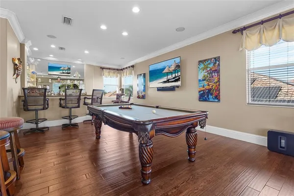 a kitchen with kitchen island granite countertop a sink counter and stainless steel appliances