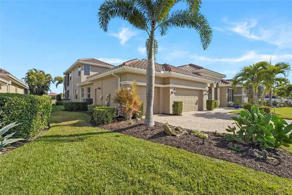 a view of a dining room with furniture and a chandelier