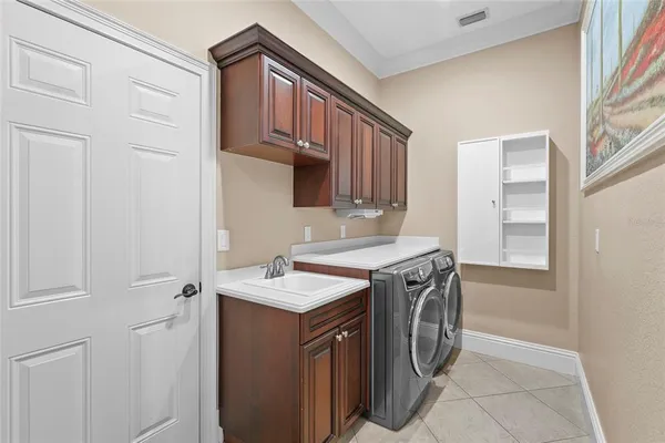 a room with wooden floors table tennis pool table and chairs