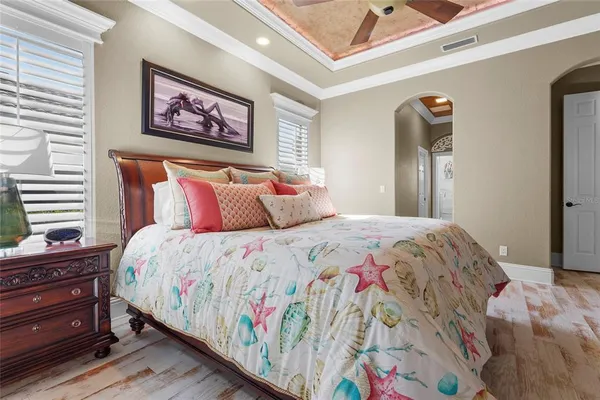 an aerial view of a house with a garden and lake view