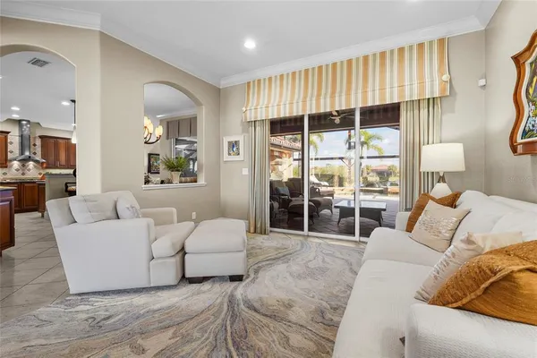 a dining room with furniture a livingroom and chandelier