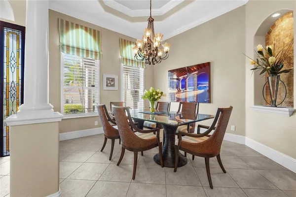 a white bath tub sitting in a bathroom next to a window