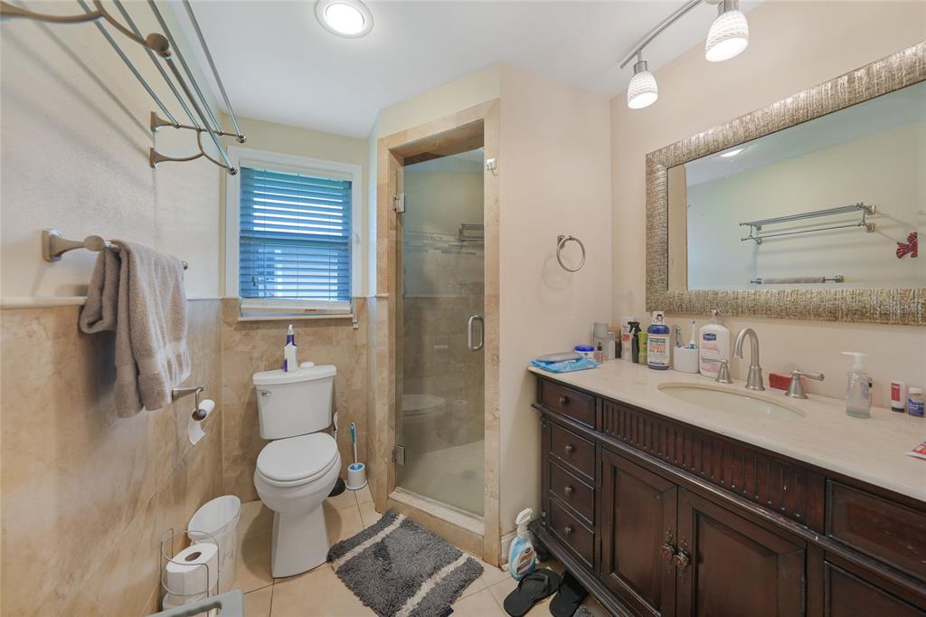 3119 Pinetree Street Port Charlotte, FL 33952 - Photo 15 of 23 a bathroom with a sink a toilet and shower