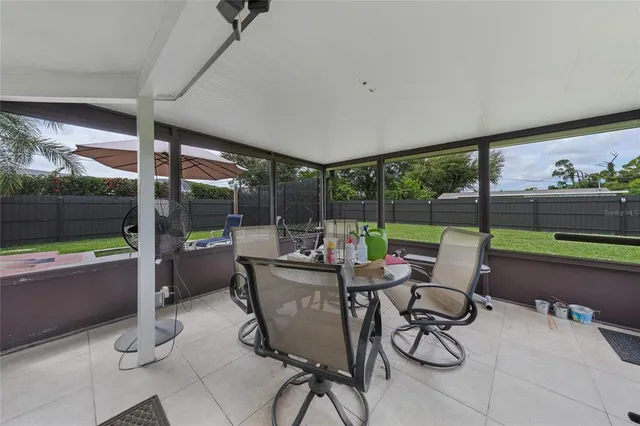 a room with lots of furniture and a large window