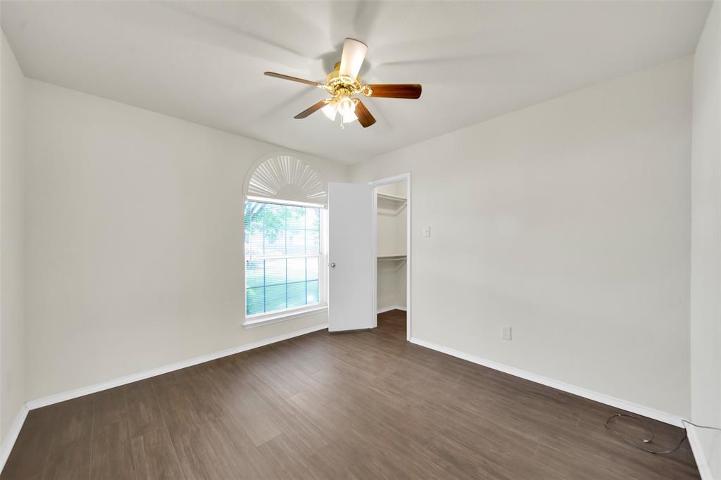4221 Fiste Denton, TX 76207 - Photo 19 of 26 Unfurnished room featuring ceiling fan and dark hardwood / wood-style flooring