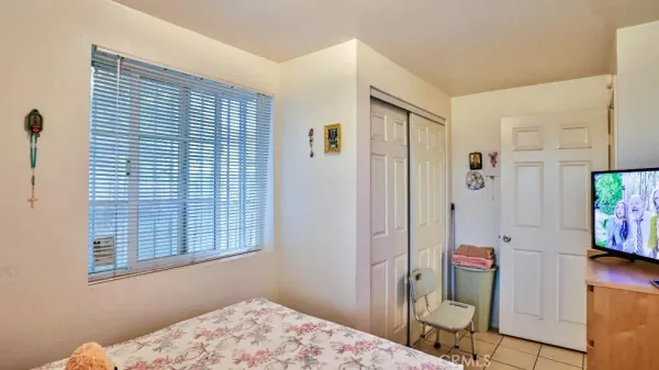 a view of a room that has a table and chairs in it