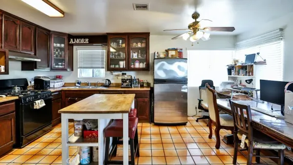 a living room with fireplace furniture and a chandelier
