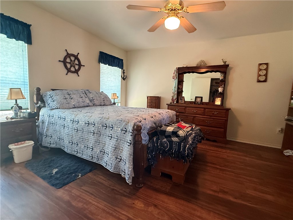 113 Santa Fe Rockport, TX 78382 - Photo 15 of 25 a bedroom with a bed and a dresser
