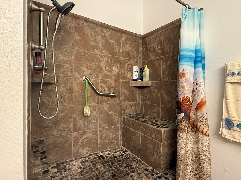 113 Santa Fe Rockport, TX 78382 - Photo 17 of 25 a bathroom with a shower