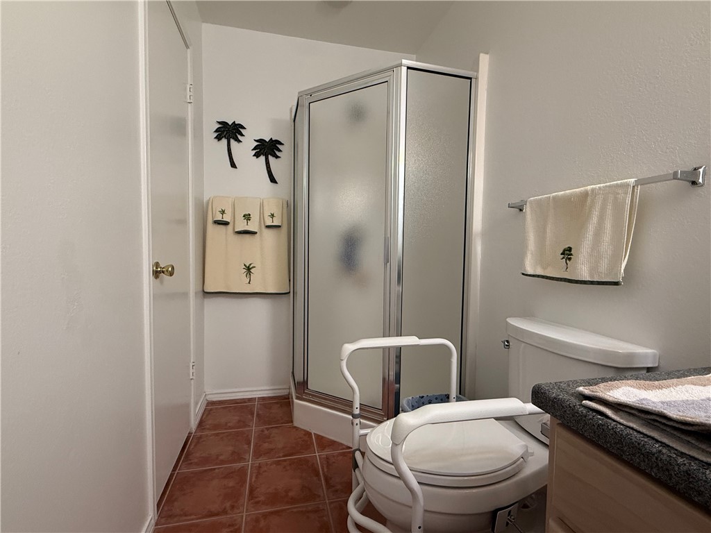 113 Santa Fe Rockport, TX 78382 - Photo 21 of 25 a bathroom with a toilet and a shower