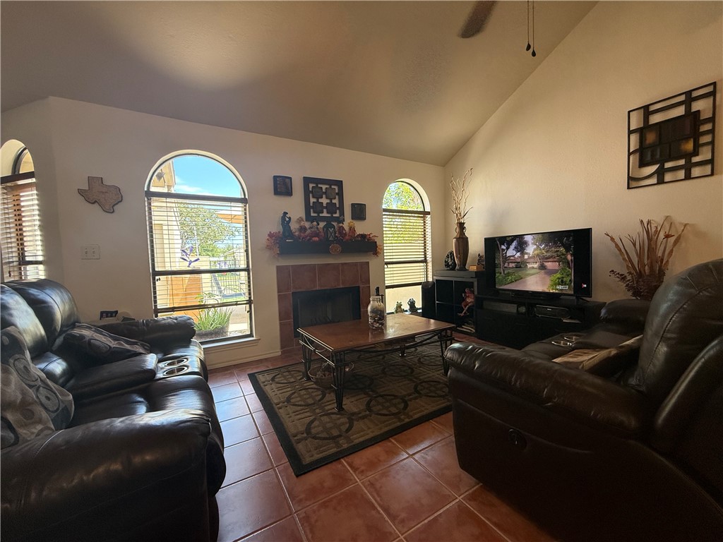 113 Santa Fe Rockport, TX 78382 - Photo 7 of 25 a living room with furniture a large window and a flat screen tv