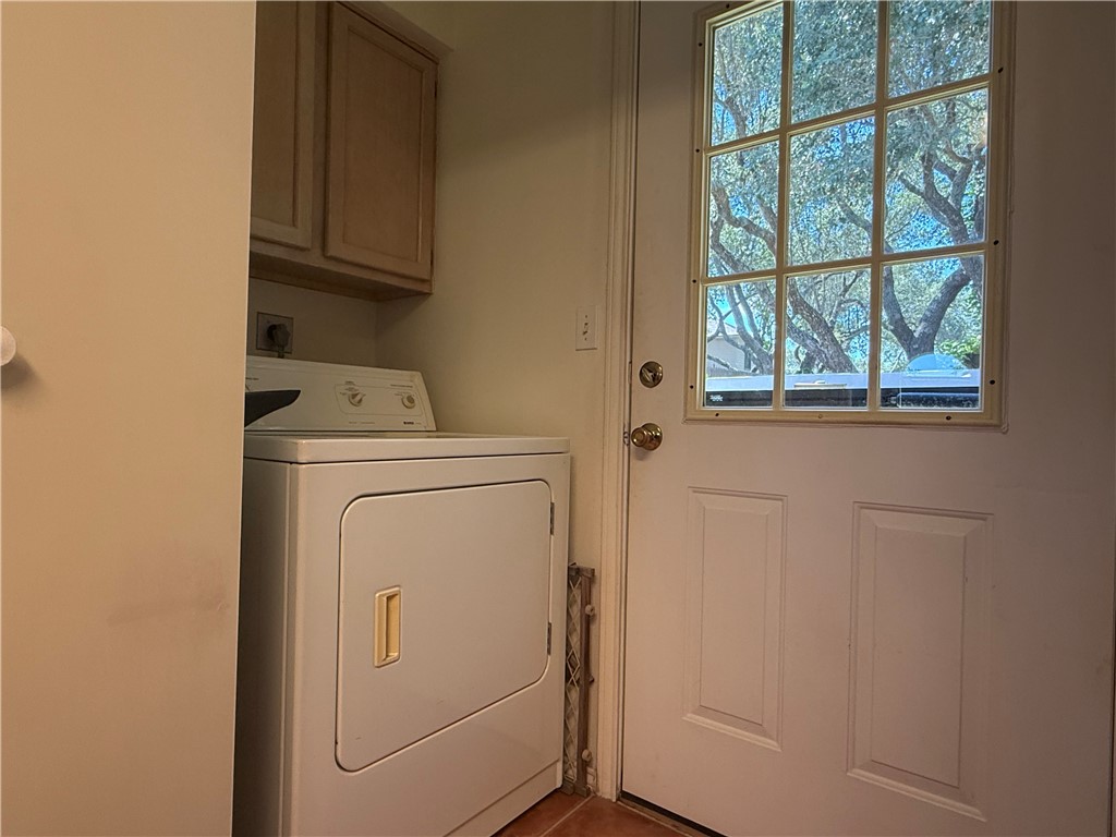 113 Santa Fe Rockport, TX 78382 - Photo 8 of 25 a utility room with dryer and washer