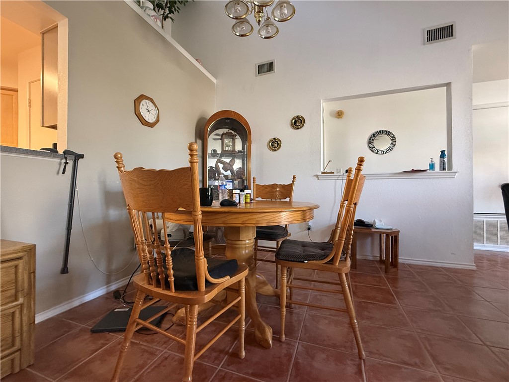 113 Santa Fe Rockport, TX 78382 - Photo 10 of 25 a view of a dining room and kitchen with a table and chairs