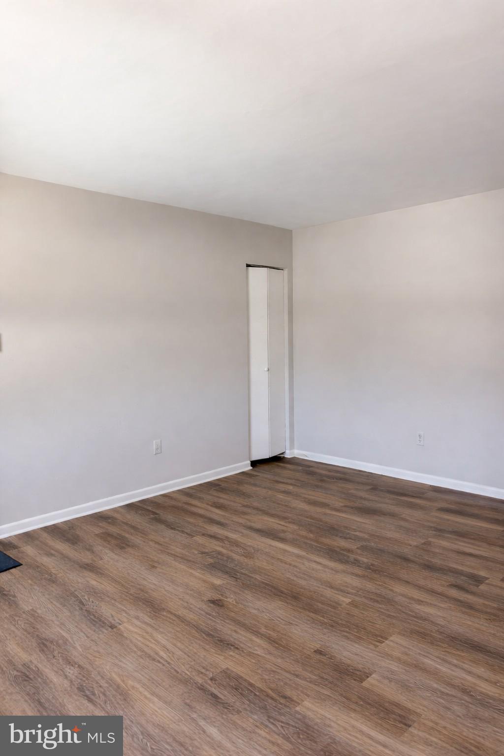 14 Girard Road South, Unit A Glassboro, NJ 08028 - Photo 6 of 7 a view of an empty room and wooden floor