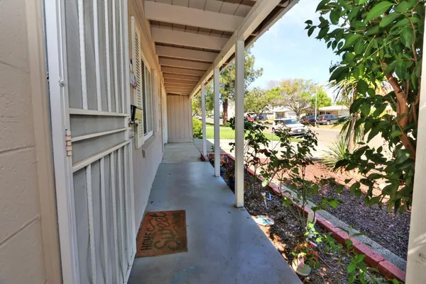 a view of a pathway of a house with wooden floor
