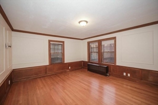 35 Greycliff Road, Unit 2 Boston, MA 02135 - Photo 11 of 26 an empty room with windows and closet
