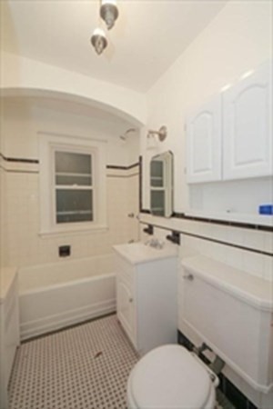 35 Greycliff Road, Unit 2 Boston, MA 02135 - Photo 20 of 26 a bathroom with a sink a toilet and shower
