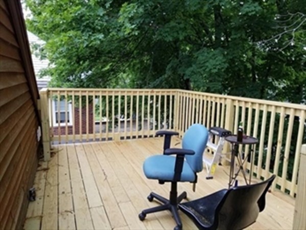 35 Greycliff Road, Unit 2 Boston, MA 02135 - Photo 26 of 26 a view of balcony with wooden floor and outdoor seating
