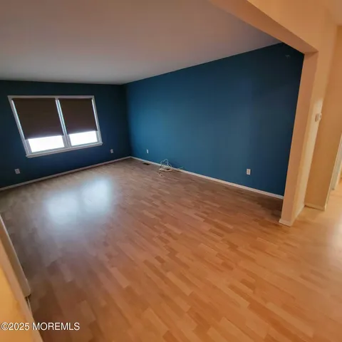 a view of an empty room with windows