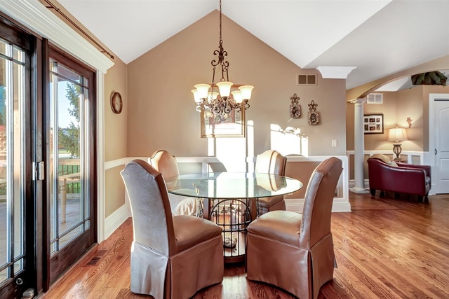 741 Longlane Road New Lenox, IL 60451 - Photo 11 of 28 a dining room with furniture a chandelier and wooden floor