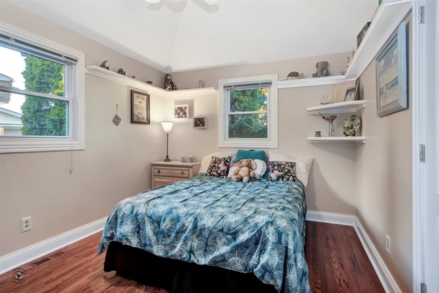 741 Longlane Road New Lenox, IL 60451 - Photo 15 of 28 a bedroom with a bed and a dresser next to a window