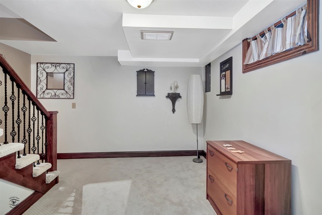 741 Longlane Road New Lenox, IL 60451 - Photo 17 of 28 a living room with a couch and a table in it